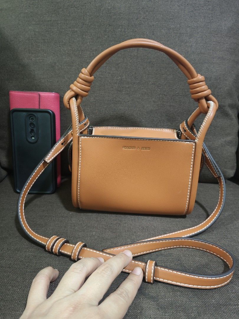 Charles & Keith mini hand/sling bag (Category: Cross-body Bags) located in Pili. Submitted by zaneombao03491 (Listing ID 1467373291, Image 1). Description: .