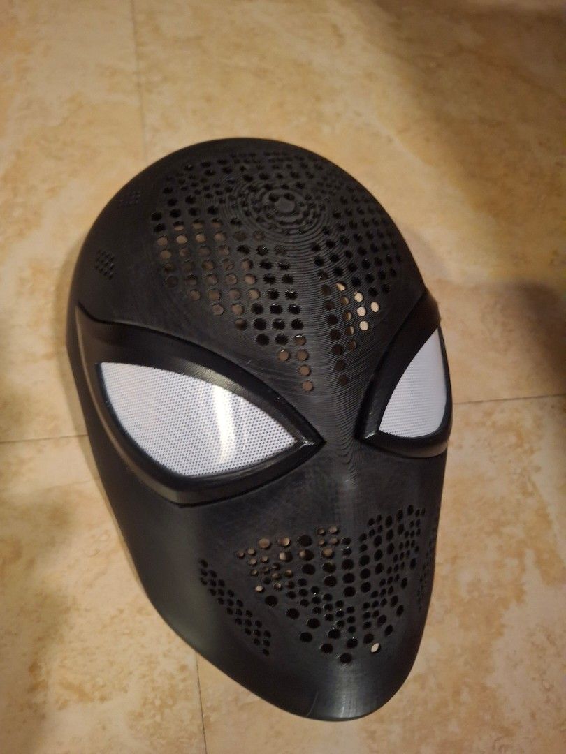 CHECCHETTO Spider-Man Face Face Shell 3D Printed Cosplay (Category: Western Merchandise) located in Valenzuela. Submitted by mlepnosclay (Listing ID 1467539721, Image 2). Description: NOTE: 23.5 HEAD CIRCUMFERENCE Search po kung pano magsukat ng head circumference. - Color/Design: Black 3D printed Spider-Man mask shell - Features: Built-in white mesh eyes and ventilation holes on front and back - Ideal Use: Great base for DIY cosplay projects and