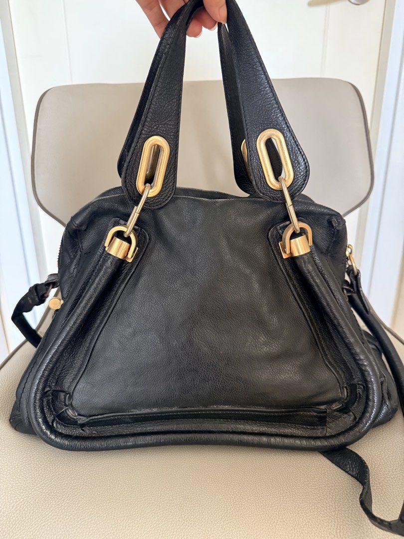 Chloé Paraty Medium Bag (Category: Luxury Bags & Wallets) located in Pasig City. Submitted by vdejesus (Listing ID 1467502338, Image 2). Description: ✨ Authentic Chloé Paraty Medium Bag (Black) Price: ₱9,000 The iconic luxury classic—the Chloé Paraty Medium Satchel in timeless black grained calfskin leather with signature gold/brass hardware detailing. Featuring its distinct trapezoidal silhouette. This versatile 2-way bag can be carried comforta