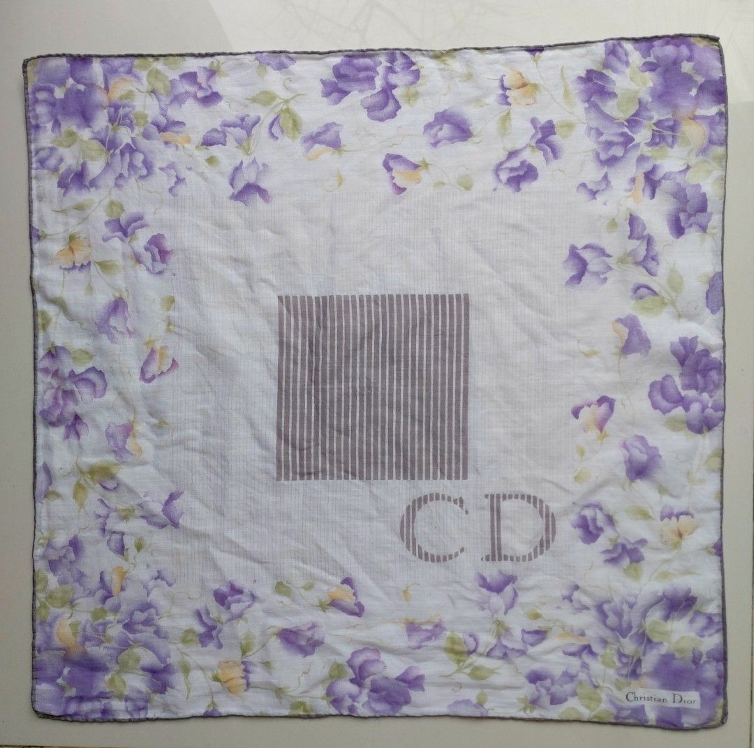 Christian Dior Floral Handkerchief (Category: Handkerchief & Pocket Squares) located in Lapu Lapu. Submitted by agnesapm_29813 (Listing ID 1467505933, Image 2). Description: - Brand: Authentic Christian Dior - Material: Soft, lightweight white cotton - Details: Signature designer logo printed in the bottom corner with a neat hand rolled edges - Measurements: 17 x 17 inches - Usage: Ideal as an everyday accessory or stylish pocket square.