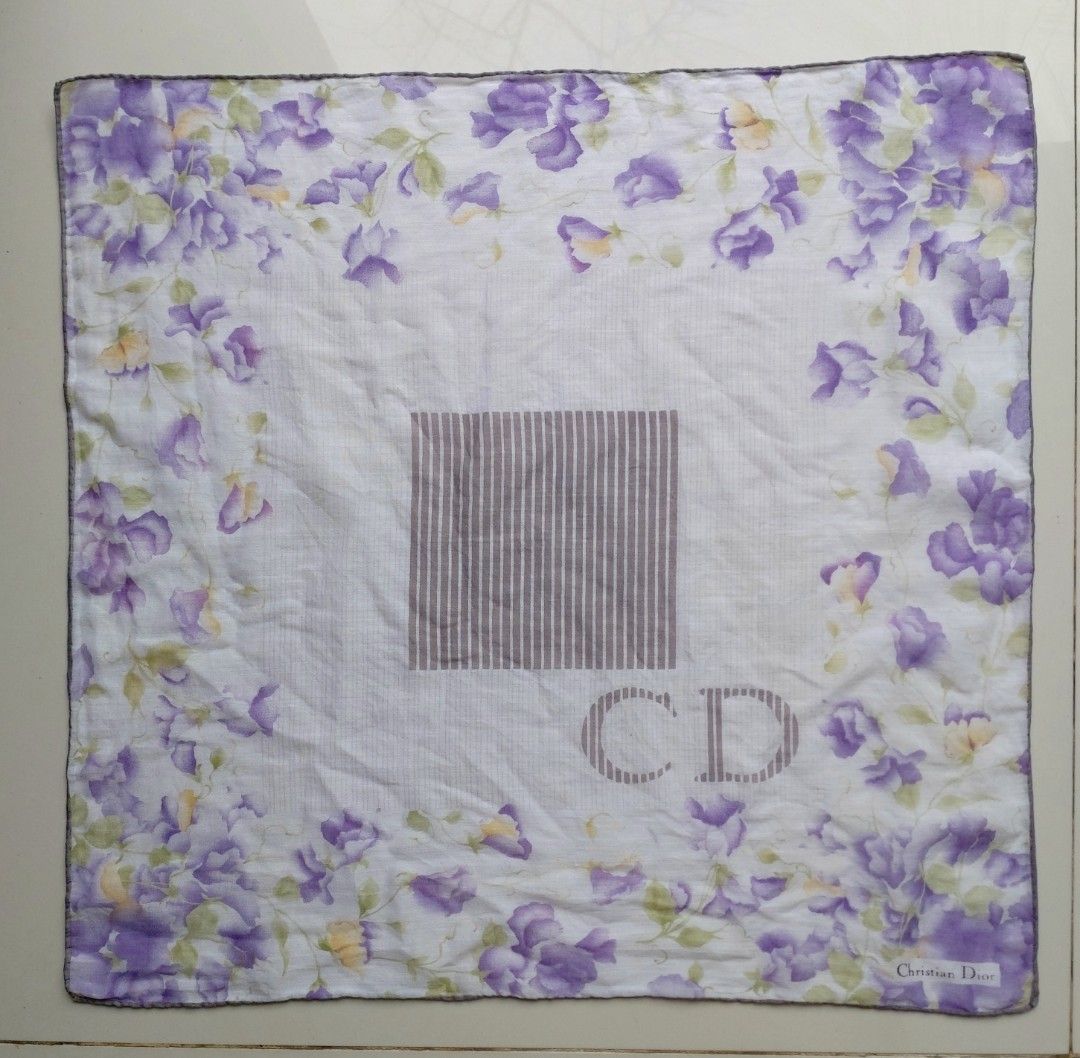 Christian Dior Floral Handkerchief (Category: Handkerchief & Pocket Squares) located in Lapu Lapu. Submitted by agnesapm_29813 (Listing ID 1467505933, Image 1). Description: - Brand: Authentic Christian Dior - Material: Soft, lightweight white cotton - Details: Signature designer logo printed in the bottom corner with a neat hand rolled edges - Measurements: 17 x 17 inches - Usage: Ideal as an everyday accessory or stylish pocket square.