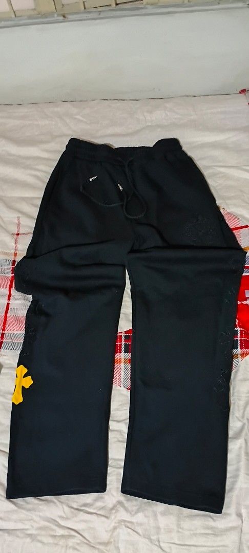 Chrome Hearts Cross Patch Sweatpants Black Yellow (Category: Joggers) located in San Ildefonso. Submitted by rigor32eva20161 (Listing ID 1467389446, Image 1). Description: - Brand: Chrome Hearts - Color: Black with black cross patches and one standout yellow leather cross patch near the cuff - Material: Premium heavy cotton for ultimate comfort and durability - Fit: Relaxed streetwear fit - Details: Adjustable drawstring waist with branded silver