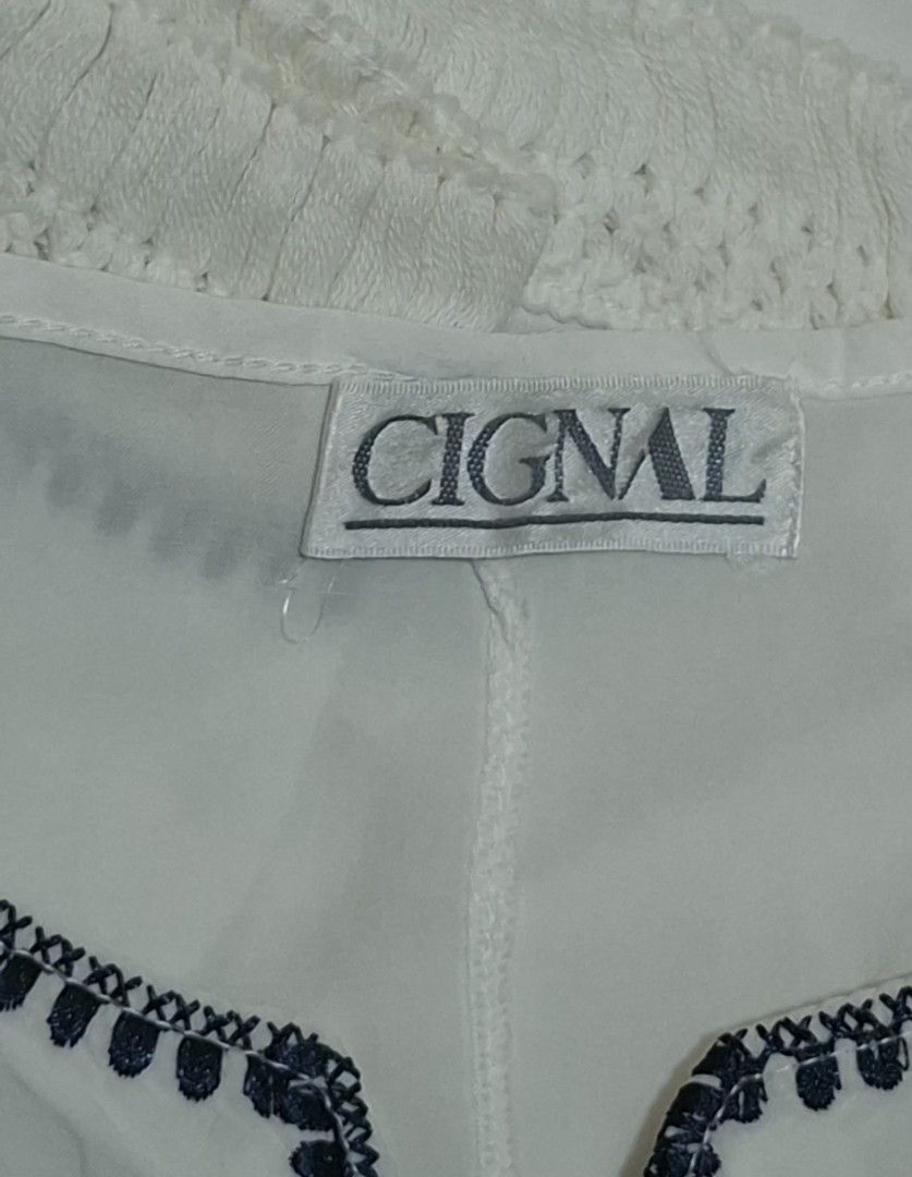 Cignal Embroidered Boho Poncho Kaftan Top (White/Navy) (Category: Blouses) located in Quezon City. Submitted by MP_Declutters (Listing ID 1467427305, Image 2). Description: Description: ✨ Cignal Resortwear Poncho Blouse ✨ Brand: Cignal Color: White base with deep navy blue floral embroidery Style: Relaxed poncho/kaftan silhouette with a flattering V-neck, wide draped wing sleeves, and a continuous lace crochet fringe trim lining the bottom hem Fi