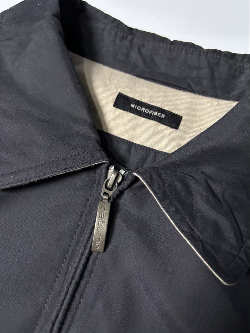 Claiborne Outerwear Microfiber Jacket Black Size L (Category: Coats, Jackets and Outerwear) located in Cabuyao City. Submitted by macnthrifts. (Listing ID 1467521484, Image 2). Description: - Brand: Claiborne - Type: Zip-up outerwear jacket - Material: Microfiber with neutral beige lining - Size: Large - Details: Classic collar, metal zipper pull, snap button cuffs - Condition: Clean interior garment and care tags - Origin: Made in Vietnam - Styl