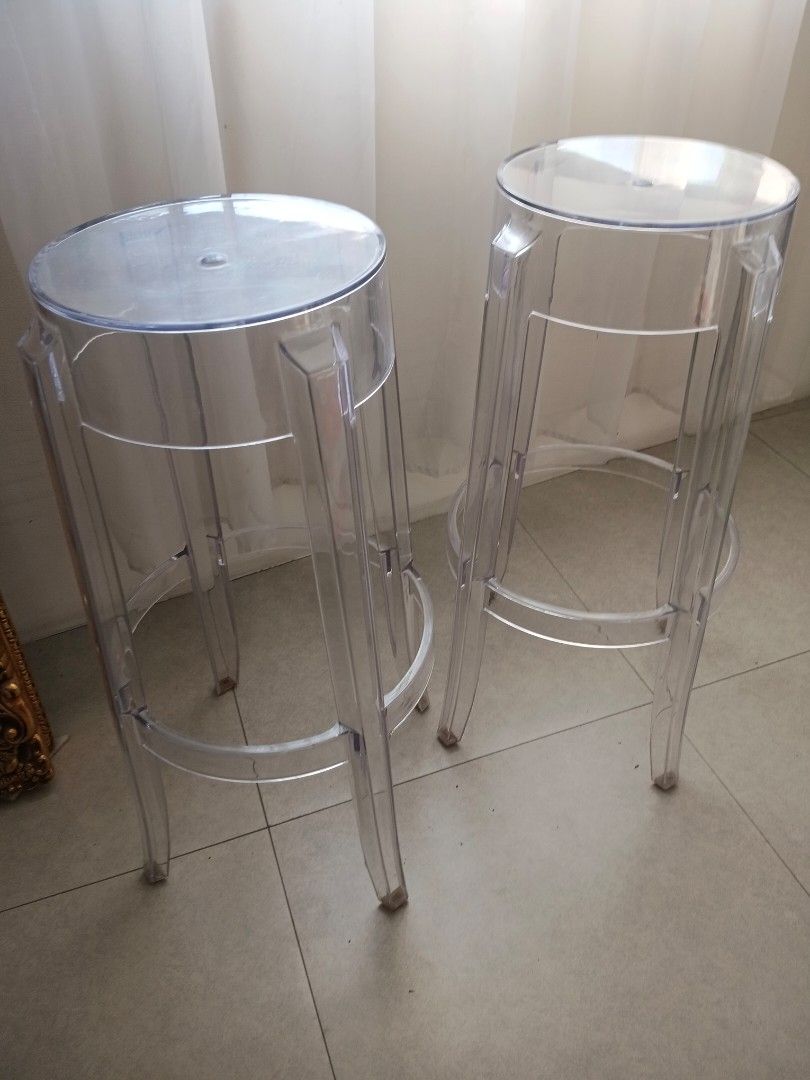Clear Acrylic Bar Stools (Category: Chairs) located in Quezon City. Submitted by pile.of.stuff (Listing ID 1467399342, Image 2). Description: Clear Acrylic Bar Stools - Standard counter height with backless design - Sturdy legs connected by a circular footrest ring - Sleek, minimalist look ideal for modern kitchen islands - Lightweight yet stable - Great overall condition - Stored only. Never used 3,000.00 for a pair.