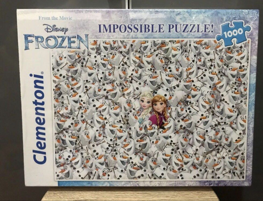 Clementoni Disney Frozen 1000 Piece Impossible Puzzle (Category: Board Games & Puzzles) located in Marikina City. Submitted by zobel.yanna (Listing ID 1467397821, Image 1). Description: - Brand: Clementoni - Theme: Disney Frozen (Anna, Elsa, and Olaf faces) - Piece Count: 1000 pieces - Series: Impossible Puzzle - Condition: Brand new, sealed in original plastic wrapping - Ideal for puzzle enthusiasts and Disney fans.