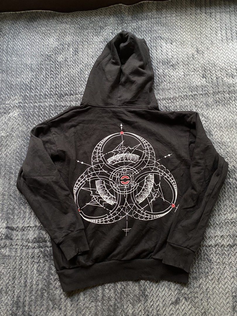 Cloth X Fragment (Category: Coats, Jackets and Outerwear) located in Olongapo. Submitted by WAVYT (Listing ID 1467434355, Image 3). Description: - Color: Black - Size: Medium - Material: 100% cotton (Made in China) - Design: Geometric biohazard graphic on the back and chest patch - Features: Roomy front pocket and comfortable fit - Care: Hand wash recommended.