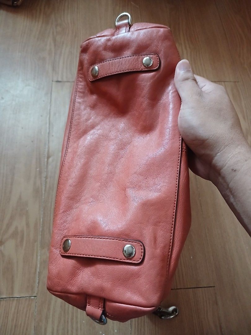 Coach Ashley Leather Shoulder Bag (Category: Luxury Bags & Wallets) located in Daraga. Submitted by thethriftcity2024 (Listing ID 1467435633, Image 3). Description: - Brand: Coach Authentic - Color: Coral Pink with silver-tone hardware - Material: Genuine leather - Handles: Dual top handles + detachable shoulder strap with padded grip - Closure: Secure zip top - Interior: Grey fabric lining with 'Made in China' tag - Extras: Original Coach leathe