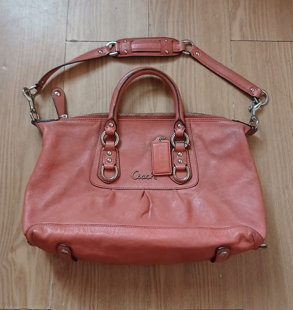 Coach Ashley Leather Shoulder Bag (Category: Luxury Bags & Wallets) located in Daraga. Submitted by thethriftcity2024 (Listing ID 1467435633, Image 1). Description: - Brand: Coach Authentic - Color: Coral Pink with silver-tone hardware - Material: Genuine leather - Handles: Dual top handles + detachable shoulder strap with padded grip - Closure: Secure zip top - Interior: Grey fabric lining with 'Made in China' tag - Extras: Original Coach leathe