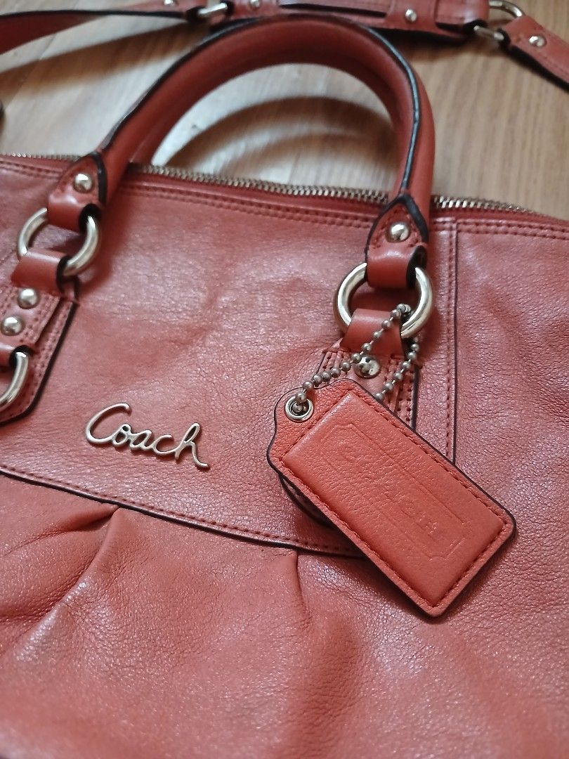 Coach Ashley Leather Shoulder Bag (Category: Luxury Bags & Wallets) located in Daraga. Submitted by thethriftcity2024 (Listing ID 1467435633, Image 2). Description: - Brand: Coach Authentic - Color: Coral Pink with silver-tone hardware - Material: Genuine leather - Handles: Dual top handles + detachable shoulder strap with padded grip - Closure: Secure zip top - Interior: Grey fabric lining with 'Made in China' tag - Extras: Original Coach leathe