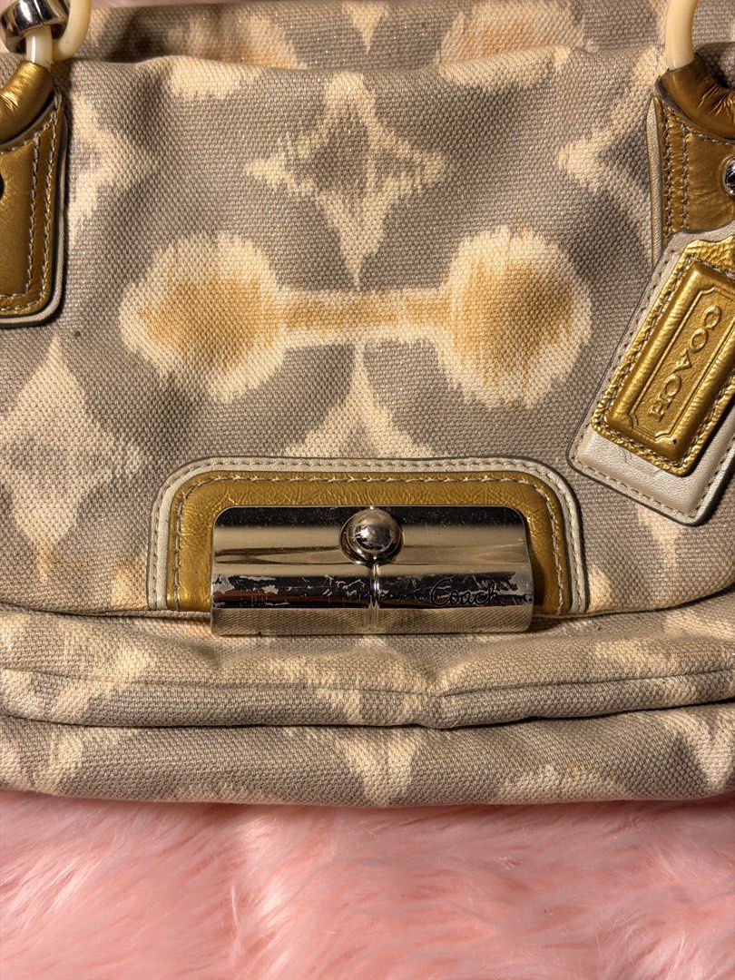 coach bag (Category: Shoulder Bags) located in Daraga. Submitted by littlemissdeclutter.wtme (Listing ID 1467576759, Image 2). Description: Coach Kristin Op Art I-Cat Print satchel handbag. A grey and multi-color signature Op Art pattern on canvas or sateen fabric with leather trim and gold-tone hardware. The bag has double top handles for hand or elbow carry and may include a detachable shoulder strap (not inlcuded). ⁃ kindly manage your expecta