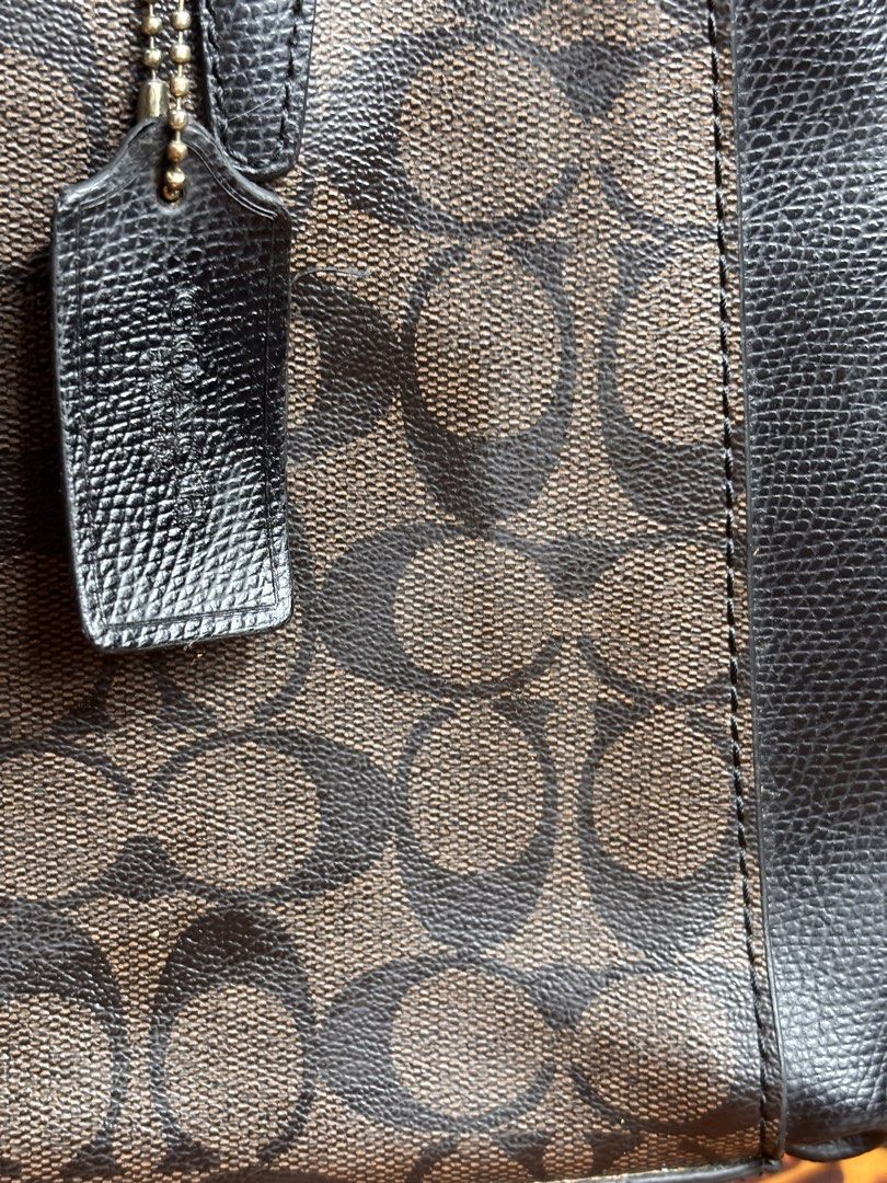 Coach Brown/Black Monogram Canvas Leather Bag (Category: Shoulder Bags) located in Manila. Submitted by earlylifecrisis3 (Listing ID 1467364150, Image 3). Description: Condition 7/10 Measure it by inch Width: 13 Length: 9 Depth: 4 Handle: 8 •Refund / Returns not allowed allowed •Please do check the dimensions size on labels sometimes are not accurate on the sizing •Ask me before purchasing.