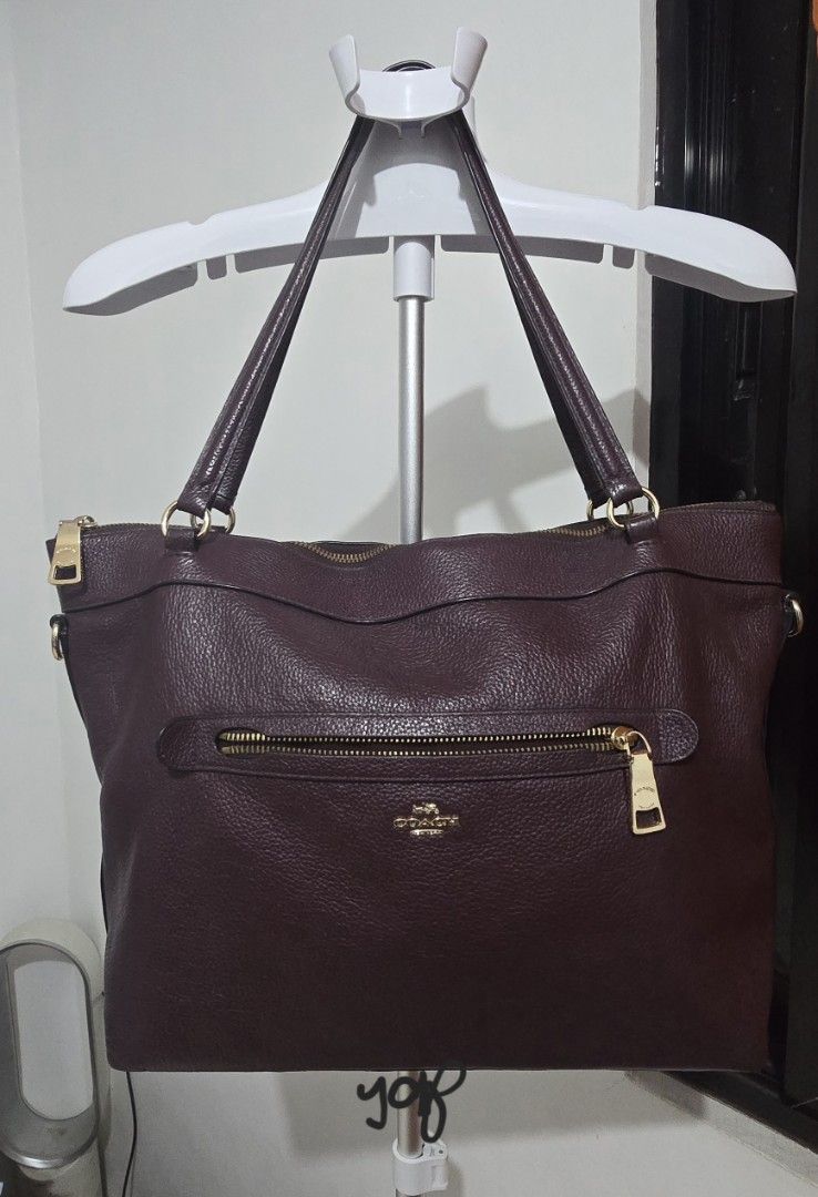 Coach Pebbled Leather Gallery Tote Bag (Category: Luxury Bags & Wallets) located in Cabuyao City. Submitted by grasiyas (Listing ID 1467491586, Image 1). Description: - Authentic Coach tote bag in a stunning deep purple pebbled leather - Elegant gold-tone hardware and front zip pocket with branded pull - Comfortable dual shoulder straps and secure top zip closure - Spacious fully lined interior with a zip pocket and slip pockets - Protective meta