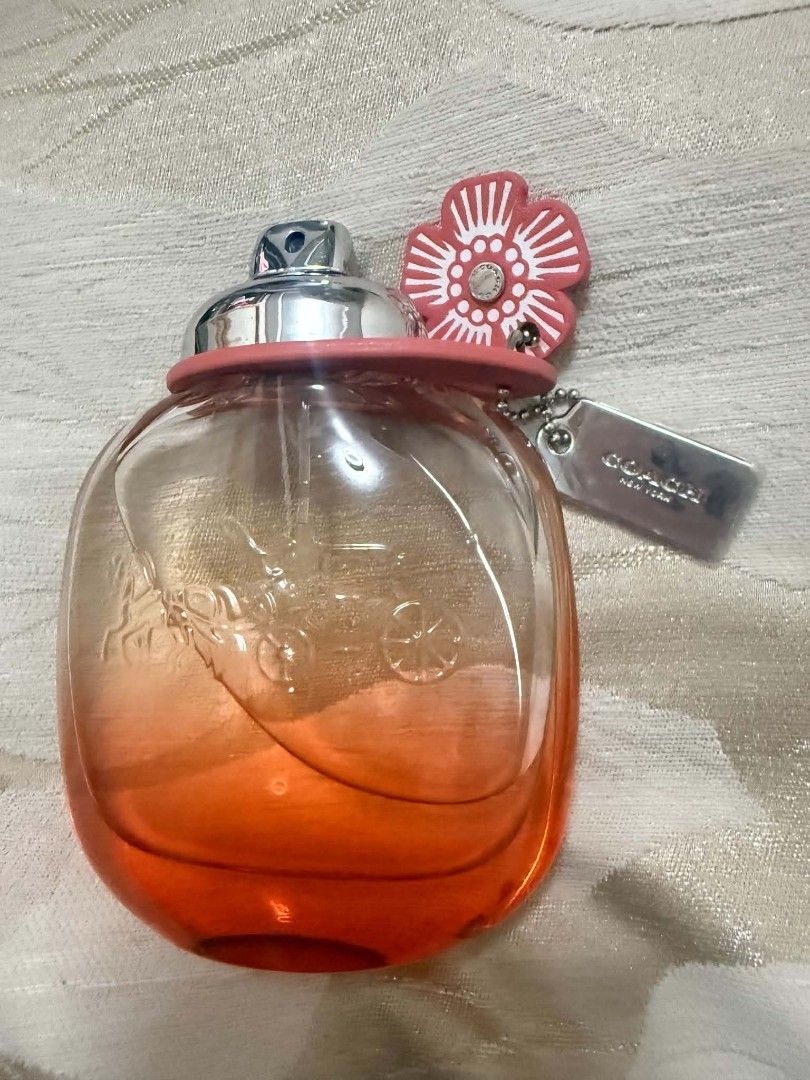 Coach Floral Blush Eau de Parfum 90ml (Category: Fragrance & Deodorants) located in Pinamalayan. Submitted by chay0921 (Listing ID 1467524823, Image 3). Description: - Authentic Coach Floral Blush fragrance - Roughly half full, great way to try the scent - Beautiful pink gradient glass bottle with embossed horse and carriage logo - Includes original leather flower charm and silver hangtag - Spray nozzle fully functioning - Perfect for daily wear 