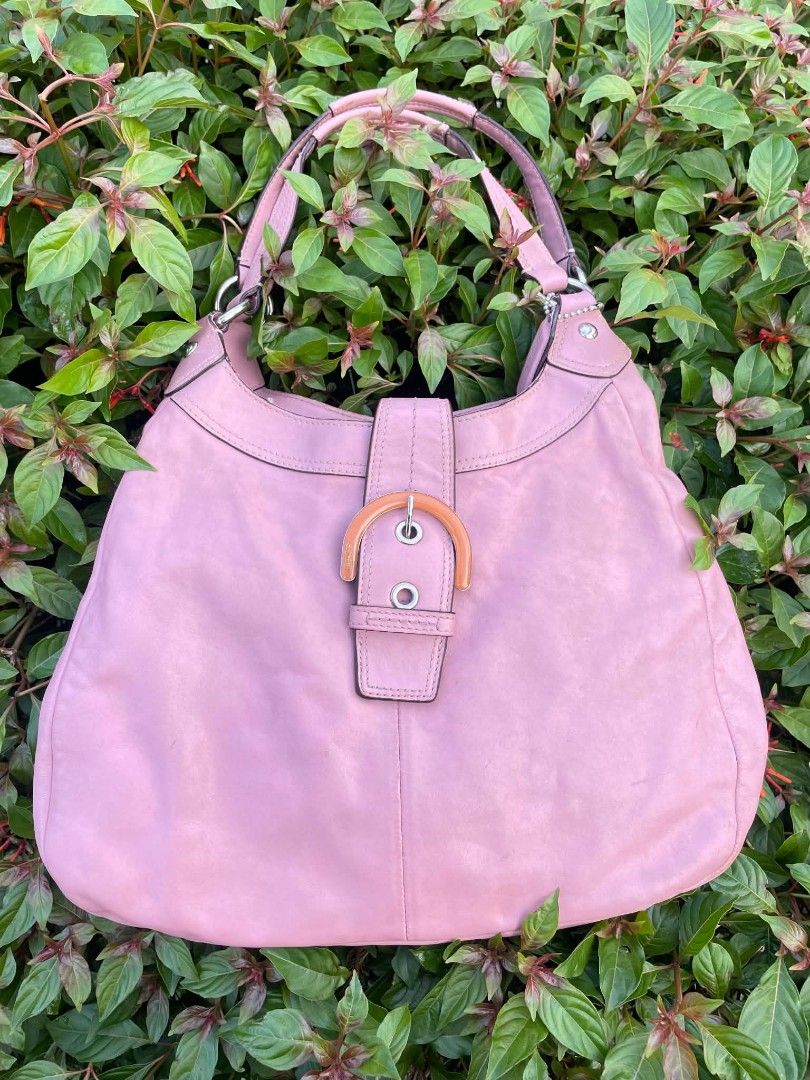 Coach Pink Leather Hobo Shoulder Bag (Category: Luxury Bags & Wallets) located in Cainta. Submitted by mariss.luxx (Listing ID 1464640182, Image 2). Description: - Genuine pink leather Coach hobo bag - Stylish buckle detail on the front - Interior zip pocket and small patch pocket - Ideal size for everyday essentials - Made in China.