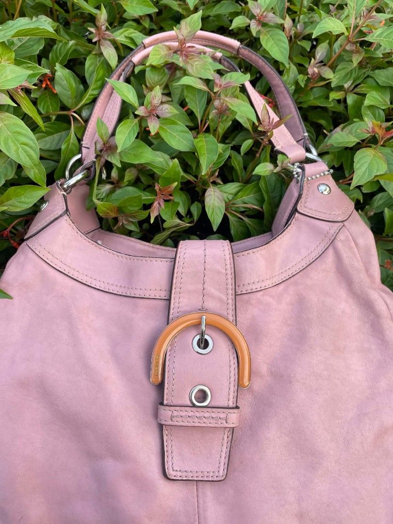Coach Pink Leather Hobo Shoulder Bag (Category: Luxury Bags & Wallets) located in Cainta. Submitted by mariss.luxx (Listing ID 1464640182, Image 3). Description: - Genuine pink leather Coach hobo bag - Stylish buckle detail on the front - Interior zip pocket and small patch pocket - Ideal size for everyday essentials - Made in China.
