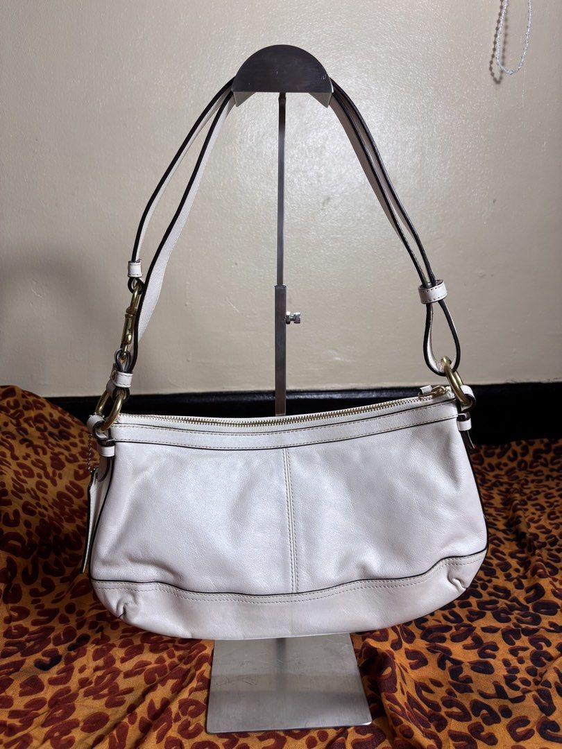 Coach Shoulder Bag (Category: Shoulder Bags) located in Manila. Submitted by earlylifecrisis3 (Listing ID 1467372503, Image 2). Description: Condition 9/10 Measure it by inch Width: 13 Length: 8 Depth: 1.5 Handle:9 •Refund / Returns not allowed allowed •Please do check the dimensions size on labels sometimes are not accurate on the sizing •Ask me before purchasing.