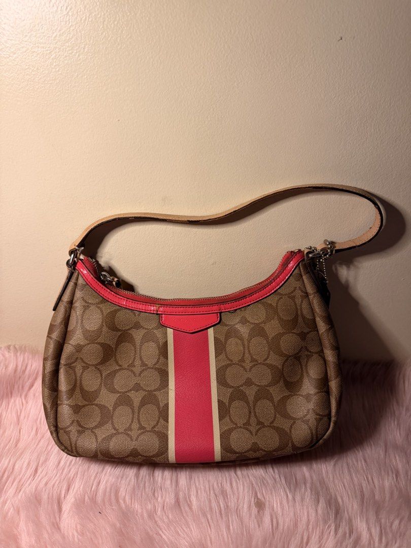 Coach Signature Stripe Demi (Category: Shoulder Bags) located in Daraga. Submitted by littlemissdeclutter.wtme (Listing ID 1467581145, Image 1). Description: Coach Signature Stripe Demi Crossbody in khaki and cerise/pink leather trim (no long strap) - which is a popular older style, likely from the 2000s or 2010s. It features the classic Coach signature canvas with a prominent vertical stripe and pink leather trim and straps. ⁃ kindly manage your