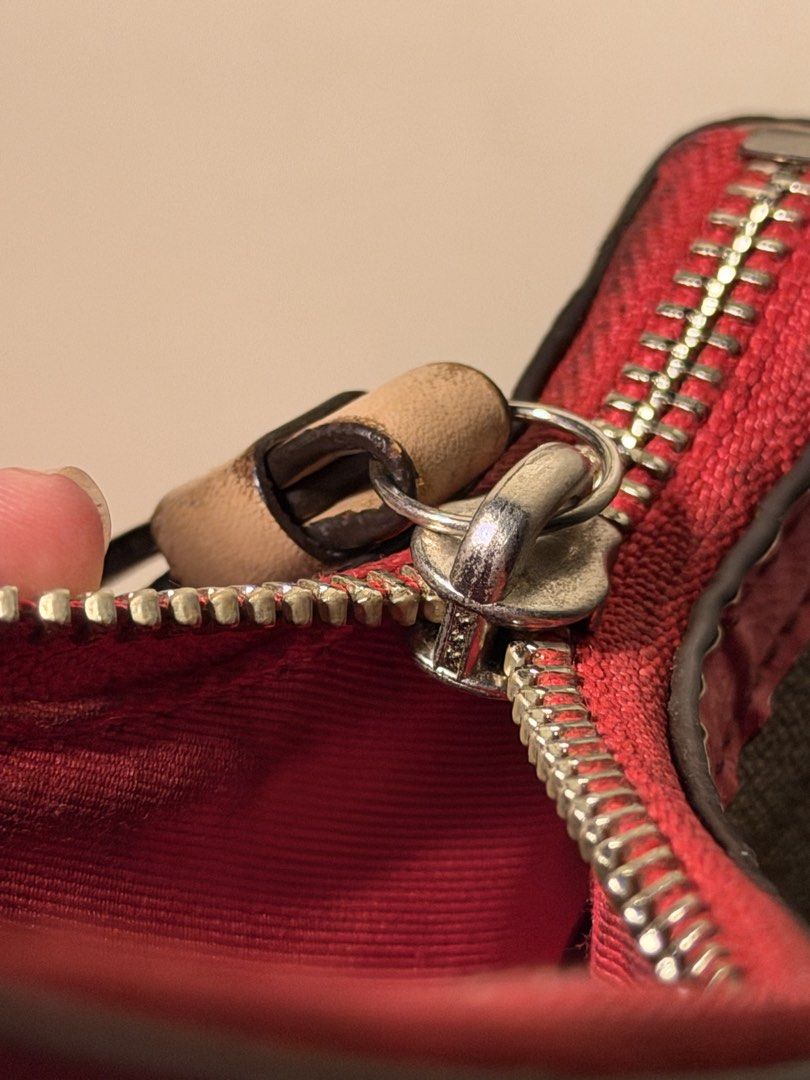 Coach Signature Stripe Demi (Category: Shoulder Bags) located in Daraga. Submitted by littlemissdeclutter.wtme (Listing ID 1467581145, Image 3). Description: Coach Signature Stripe Demi Crossbody in khaki and cerise/pink leather trim (no long strap) - which is a popular older style, likely from the 2000s or 2010s. It features the classic Coach signature canvas with a prominent vertical stripe and pink leather trim and straps. ⁃ kindly manage your
