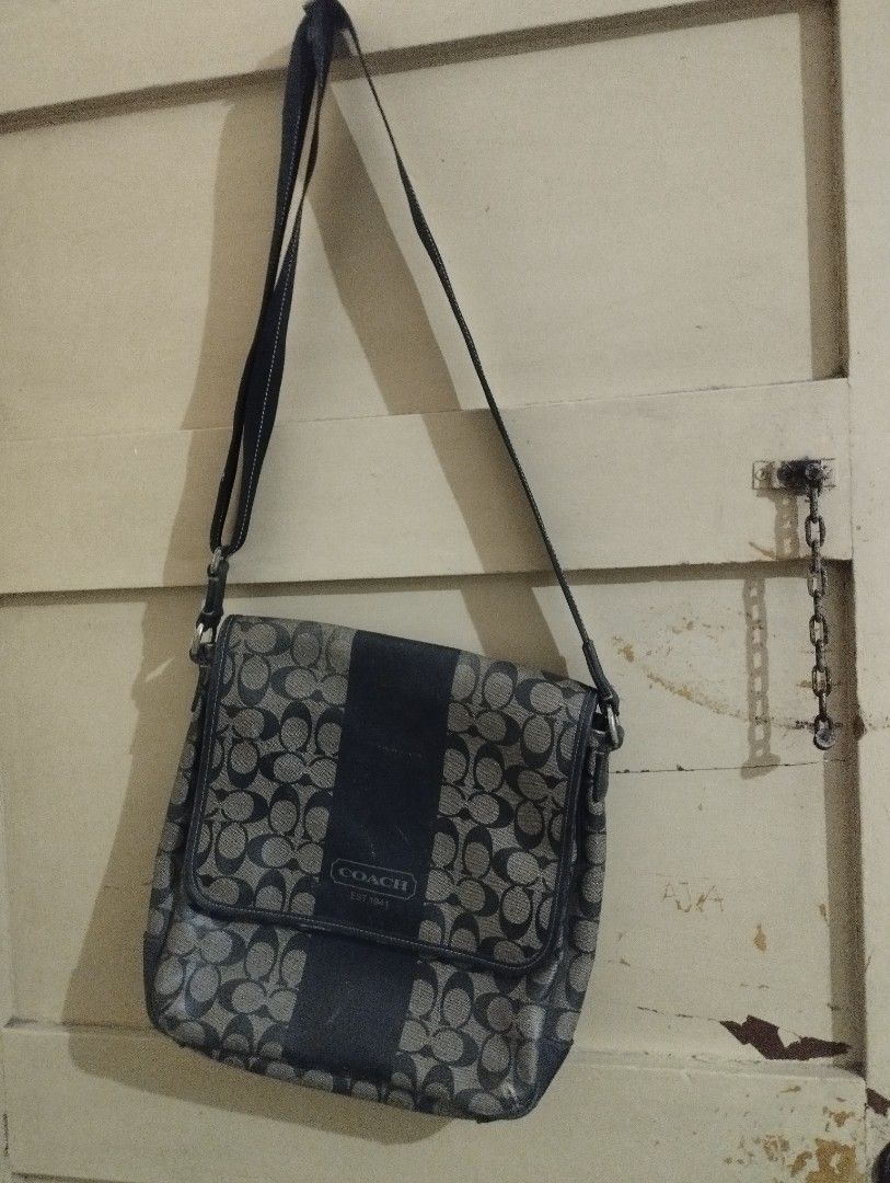 COACH SLING BAG GALING ABROAD (Category: Luxury Bags & Wallets) located in Mandaluyong City. Submitted by LEATHERFACE (Listing ID 1467396331, Image 1). Description: - Authentic Coach messenger bag in black and brown signature C jacquard fabric - Stylish vertical center stripe with embossed Coach Est 1941 logo - Secure flap closure with buckle accent - Long adjustable strap for comfortable crossbody wear - Clean fabric-lined interior with convenie