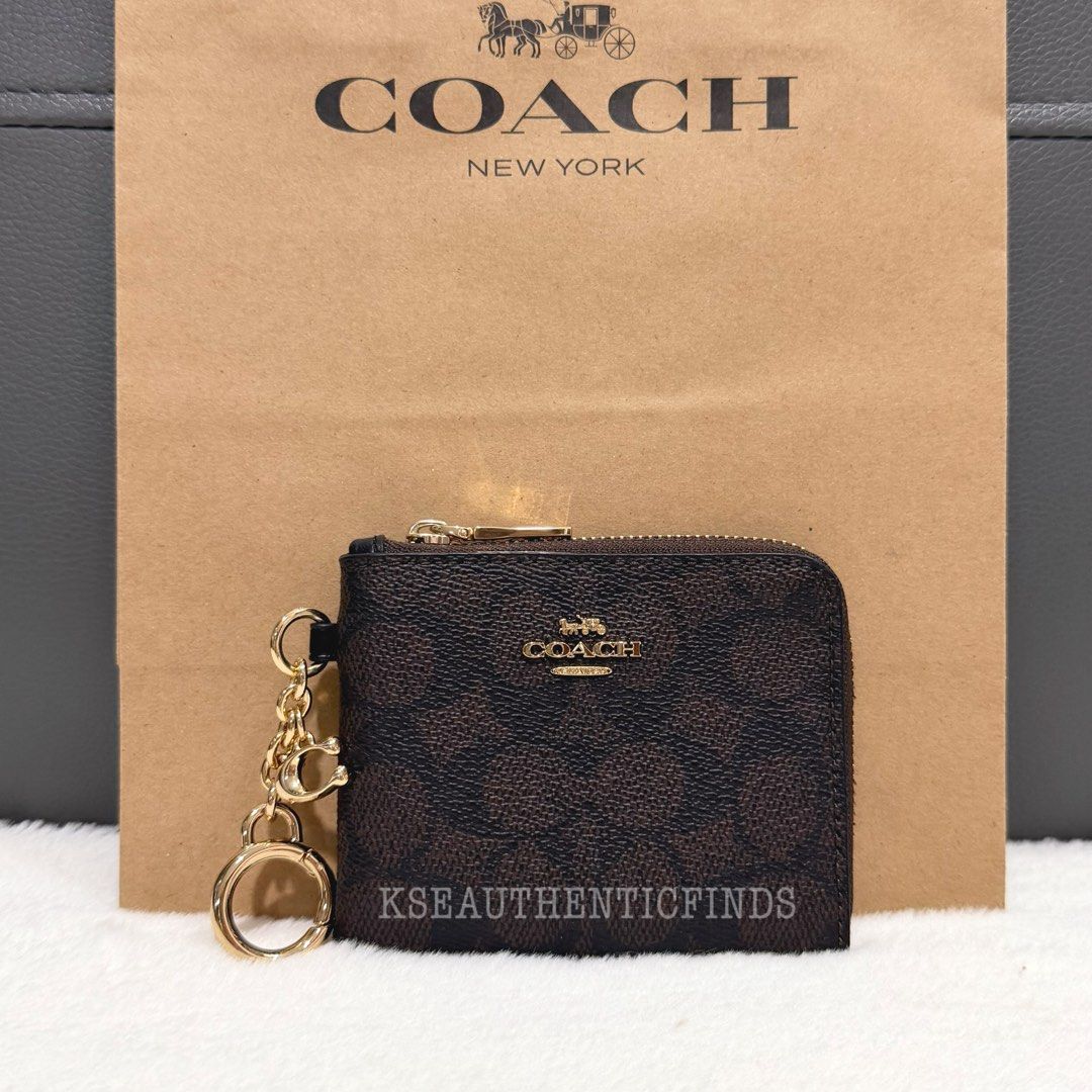 COACH Small Corner Zip Wallet in Walnut/Black 🇨🇦 (Category: Wallets & Card holders) located in Pasig City. Submitted by kseauthenticfinds (Listing ID 1467446679, Image 1). Description: 𝗡𝗲𝘄 𝗔𝗿𝗿𝗶𝘃𝗮𝗹✨ Small Corner Zip Wallet in Walnut/Black 🇨🇦 Inclusion/s: tag and care card Pasig/Cainta on hand Product Details Signature coated canvas and smooth leather 4.25" (L) x 3.5" (W) Five credit card slots Secure zip-around closure Attached hinge