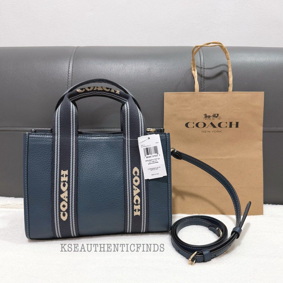 COACH Smith Tote 24 in Denim Multi 🇨🇦 (Category: Cross-body Bags) located in Pasig City. Submitted by kseauthenticfinds (Listing ID 1467449033, Image 3). Description: 𝗡𝗲𝘄 𝗔𝗿𝗿𝗶𝘃𝗮𝗹 ✨ Smith Tote 24 in Denim Multi 🇨🇦 Inclusion/s: tag and care card Pasig/Cainta on hand Product Details Refined pebble leather Handle: 3.75" drop Strap: Detachable 21.75" drop Outside open pocket Inside zip and multifunction pockets 9.5" (L) x 7" (H) x 4.5" (