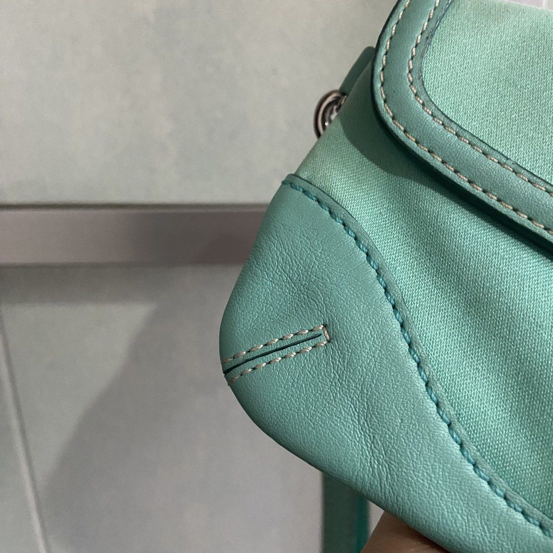 COACH SOHO WRISLET 🩵🐬 (Category: Luxury Bags & Wallets) located in Manila. Submitted by themocera (Listing ID 1467370270, Image 2). Description: What you see is what you get. • Rubber lining remains intact • No flakings or discolorations • Clean inside • Color may slightly vary due to lighting PM me for additional photos or videos. 📍Mandaluyong City.