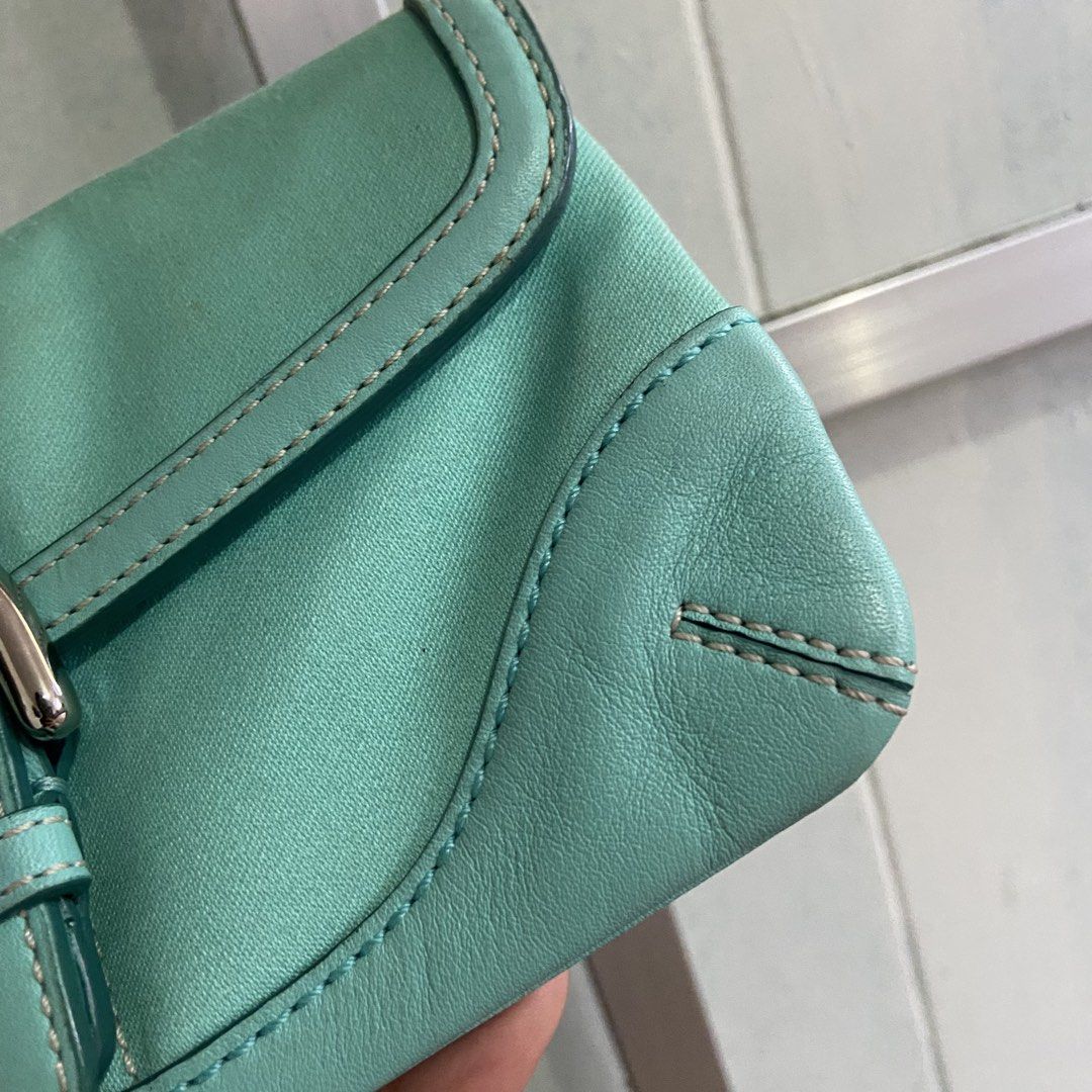 COACH SOHO WRISLET 🩵🐬 (Category: Luxury Bags & Wallets) located in Manila. Submitted by themocera (Listing ID 1467370270, Image 3). Description: What you see is what you get. • Rubber lining remains intact • No flakings or discolorations • Clean inside • Color may slightly vary due to lighting PM me for additional photos or videos. 📍Mandaluyong City.