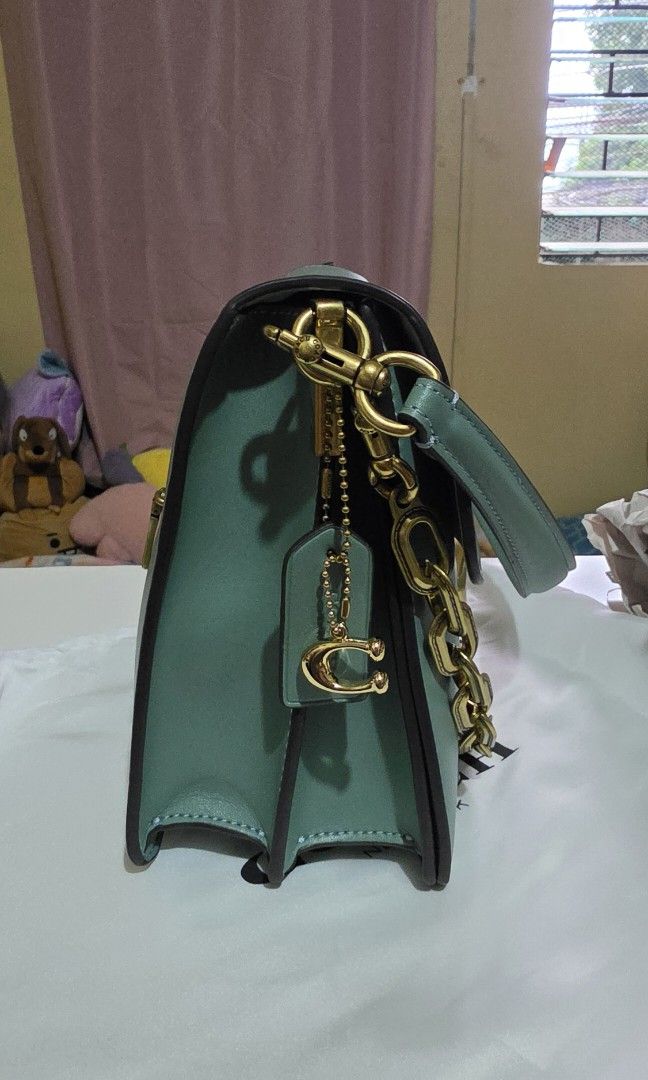 Coach Tabby Shoulder Bag Sage Green (Category: Luxury Bags & Wallets) located in Manila. Submitted by a.sta.ana13 (Listing ID 1467039690, Image 3). Description: The funds raise here will go straight to my aunt’s medical expenses - Brand: Coach - Color: Sage green - Material: Smooth leather - Hardware: Gold-tone with signature C clasp closure - Features: Trendy chunky chain link accent on the front - Strap: Includes matching adjustable leather str