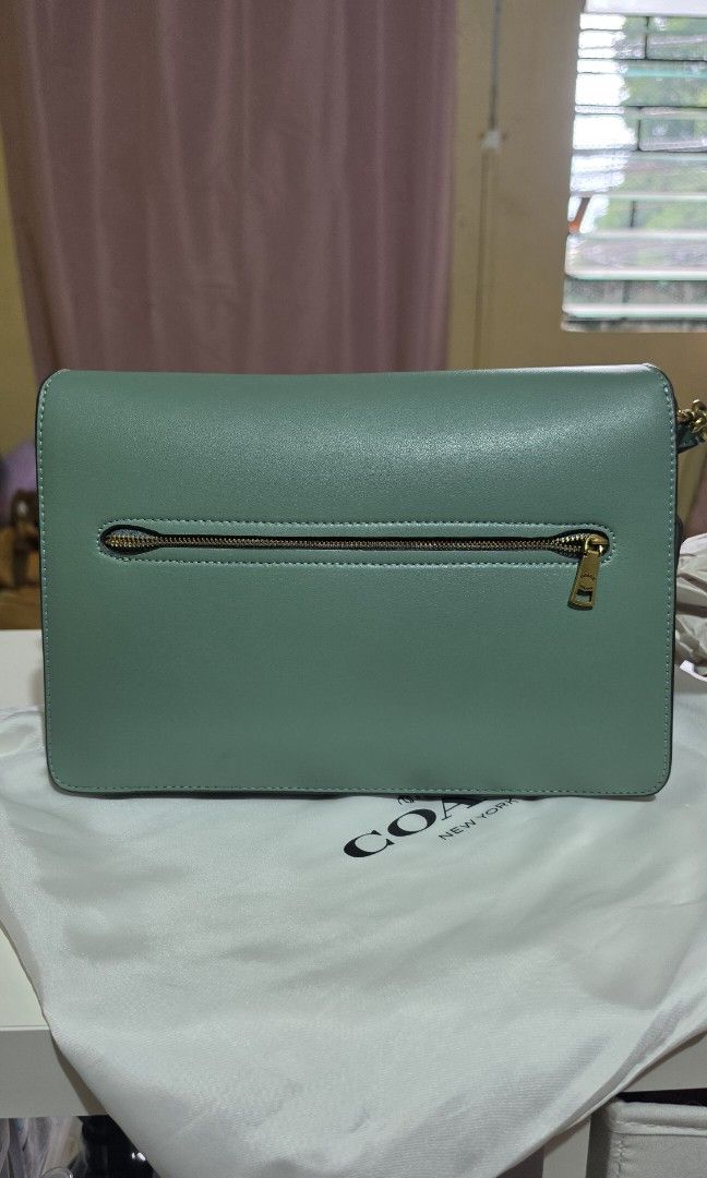 Coach Tabby Shoulder Bag Sage Green (Category: Luxury Bags & Wallets) located in Manila. Submitted by a.sta.ana13 (Listing ID 1467039690, Image 2). Description: The funds raise here will go straight to my aunt’s medical expenses - Brand: Coach - Color: Sage green - Material: Smooth leather - Hardware: Gold-tone with signature C clasp closure - Features: Trendy chunky chain link accent on the front - Strap: Includes matching adjustable leather str