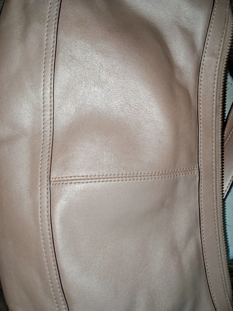 Coach Taupe Leather Shoulder Bag (Category: Luxury Bags & Wallets) located in Nagcarlan. Submitted by irishcasta73122 (Listing ID 1467373676, Image 2). Description: from Japan slightly negotiable issue po sa loob dirt - Brand: Coach - Color: Taupe - Material: Soft leather - Hardware: Gold-tone with front script logo plate - Closure: Secure zip top - Strap: Adjustable with brass side rings - Condition: Clean stitching and well-maintained.