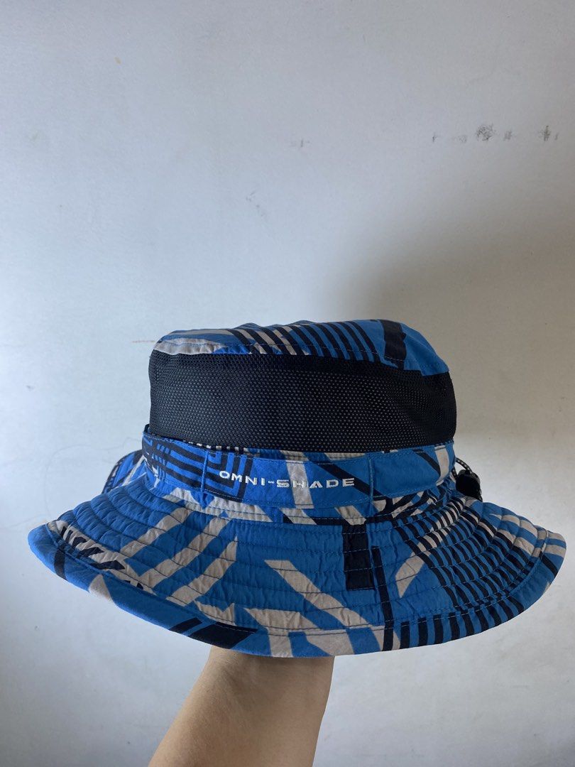 Columbia Omni-Shade Blue Patterned Bucket Hat (Category: Caps & Hats) located in Manila. Submitted by kennyfranc39614 (Listing ID 1467514761, Image 3). Description: - Brand: Columbia - Item: bucket hat - Color/Pattern: Bright blue geometric - Features: Omni-Shade sun protection, mesh band for airflow, adjustable toggle cinch cord - Material: 100% nylon shell - Size: 56cm - Condition: Clean interior with tag intact.