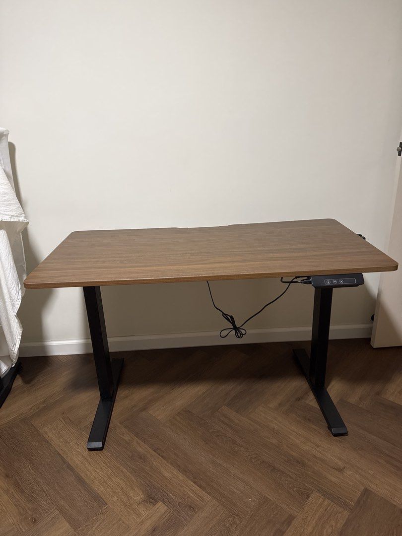 Computer Adjustable Table (Category: Tables & Sets) located in Singapore. Submitted by seesee21 (Listing ID 1467470480, Image 1). Description: Adjustable computer table With cable organiser teeth. Dimensions: Length - 120cm Depth - 60cm Dm only if interested. Self pick up or arrange for delivery. .