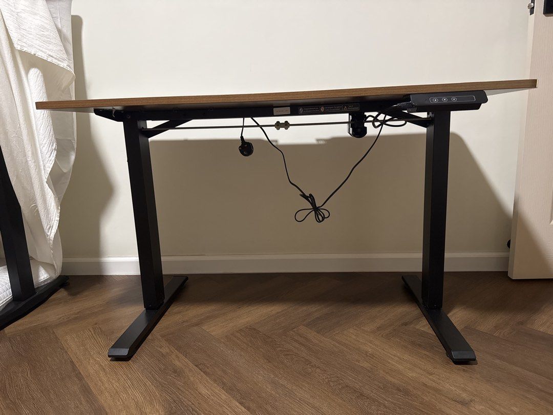 Computer Adjustable Table (Category: Tables & Sets) located in Singapore. Submitted by seesee21 (Listing ID 1467470480, Image 3). Description: Adjustable computer table With cable organiser teeth. Dimensions: Length - 120cm Depth - 60cm Dm only if interested. Self pick up or arrange for delivery. .