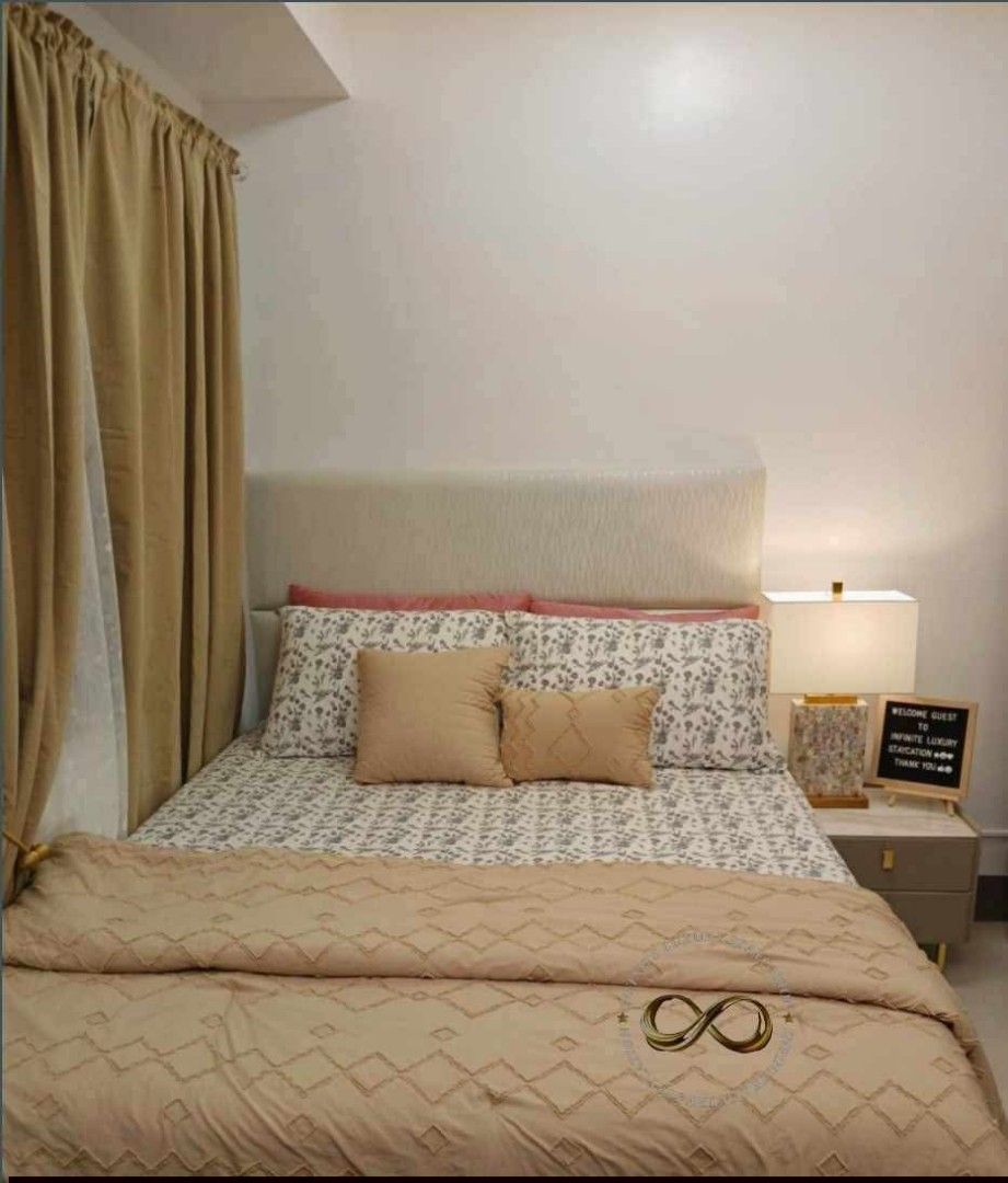 Condo staycation for sale (Category: Apartments & Condos) located in Paranaque City. Submitted by xtin626-45832 (Listing ID 1467386414, Image 3). Description: - Aesthetic cozy interior setup in neutral tones with warm wooden accents - Ideal for stylish apartments, condos, or rental spaces - Includes a wall-mounted TV console and space-saving sliding glass partition - Features a comfortable sofa, geometric rug, and decorative mirrors - Comes with 