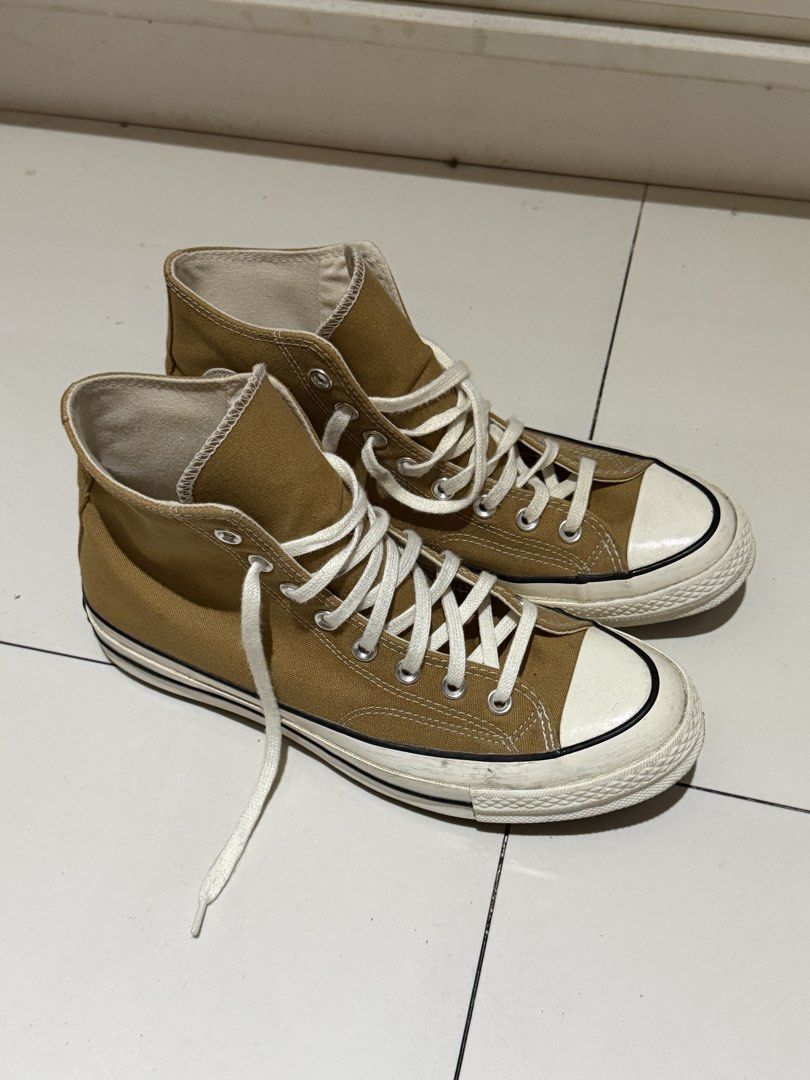 Converse Chuck 70 High Top mustard yellow (Category: Casual Shoes) located in Manila. Submitted by hatdognablue (Listing ID 1467403266, Image 1). Description: - Style: mustard yellow canvas high tops with classic Chuck Taylor ankle patch - Details: White laces, rubber toe caps, cushioned insoles, and sturdy rubber outsoles with diamond tread - Condition: Minor scuffs on the white midsoles from normal wear. RARELY USED. - Fit/Vibe: Great everyday 