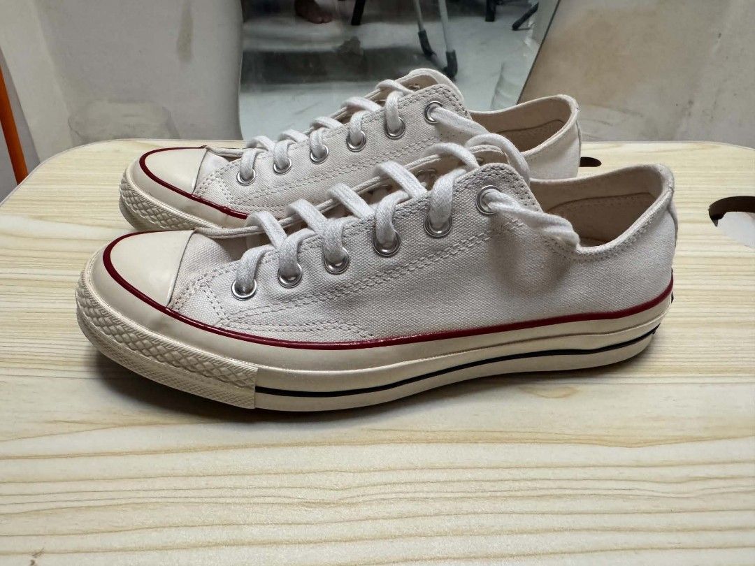 Converse Chuck 70 Low Top Parchment US7 Mens (Category: Sneakers) located in Quezon City. Submitted by screenball25 (Listing ID 1467405838, Image 1). Description: - Model: Converse Chuck 70 Low Top - Colorway: Parchment - Classic canvas upper with vintage glossy midsole - Iconic contrast black pinstripe and metal eyelets - Durable rubber toe cap and standard lacing - Clean insoles with original Converse branding intact - Versatile, timeless every