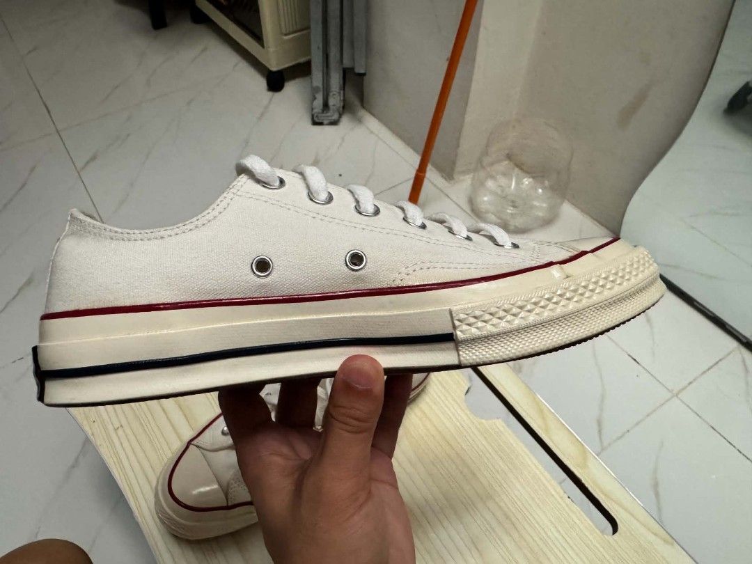 Converse Chuck 70 Low Top Parchment US7 Mens (Category: Sneakers) located in Quezon City. Submitted by screenball25 (Listing ID 1467405838, Image 3). Description: - Model: Converse Chuck 70 Low Top - Colorway: Parchment - Classic canvas upper with vintage glossy midsole - Iconic contrast black pinstripe and metal eyelets - Durable rubber toe cap and standard lacing - Clean insoles with original Converse branding intact - Versatile, timeless every