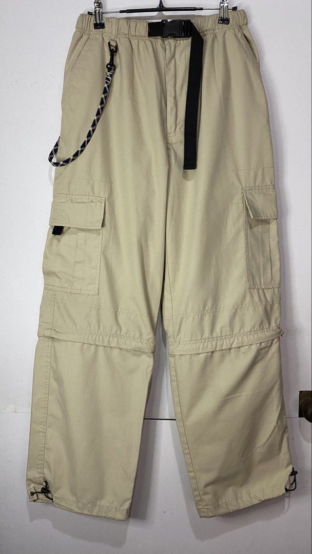 CONVERTABLE INTO SHORT (Category: Jeans) located in Jaen. Submitted by oshimamark58418 (Listing ID 1467451780, Image 1). Description: - Brand: CRU - Style: Convertible cargo pants (zips off into shorts) - Color: Beige / Khaki - Size: 30 - Features: Multiple functional cargo pockets, built-in black quick-release belt, decorative lanyard/key ring, and adjustable drawstring hems - Condition: Excellent pre-owned condition - Perfect for outdoor activi