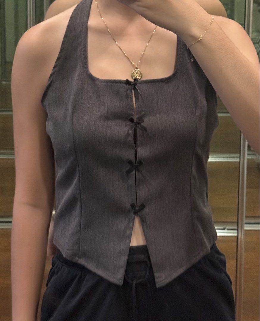 Gray Coquette Bow Vest Halter Top (Category: Sleeveless) located in Pasig City. Submitted by mxvxt (Listing ID 1467437506, Image 2). Description: 〰 brand new, never been used 〰 fits XS-S frame 〰 cute summer top! 〰 rfs: decluttering .