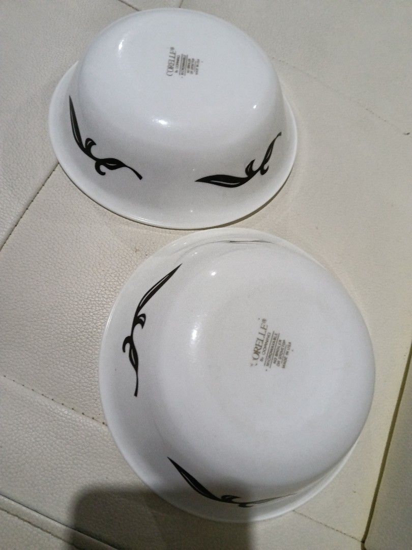 Corelle by Corning bowls with black leaf pattern (Category: Dinnerware & Cutlery) located in Manila. Submitted by zenbear_6b2d8a (Listing ID 1467387778, Image 1). Description: - Authentic Corelle by Corning bowls (Set of 2) - Features an elegant black leaf vine pattern - Standard size, ideal for cereal, soup, or desserts - Microwave safe and proudly made in the USA - Clean bottoms with glossy, intact white glaze.