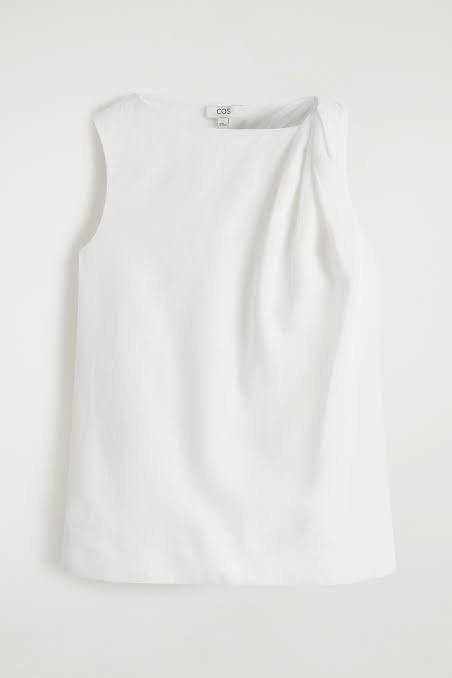 COS Twisted-Detail Linen Top (Category: Sleeveless) located in Taguig. Submitted by imgthrift (Listing ID 1467411967, Image 3). Description: Still availble in store for 5,500 - Brand: COS - Color: White - Size: EUR 36 / CN 160/84A - Material: Lightweight linen - Design: Sleeveless, round neckline, relaxed fit with unique twisted shoulder detail - Style: Clean, classic minimalist, perfect for pairing with trousers or skirts.