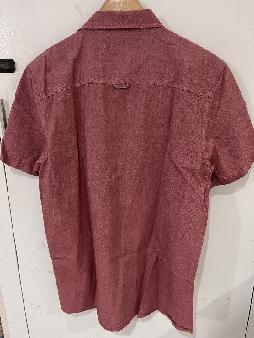 Cotton On Red Short Sleeve Button Down Polo Size L (Category: Tshirts & Polo Shirts ) located in Quezon City. Submitted by littleparties (Listing ID 1467398636, Image 3). Description: - Brand: Cotton On 19 Ninety:One - Size: L (true to size) - Color: Red with grey inside collar lining - Style: Short sleeve button-down, standard collar - Details: Front left chest pocket, clean solid color design - Condition: Great casual wardrobe staple.