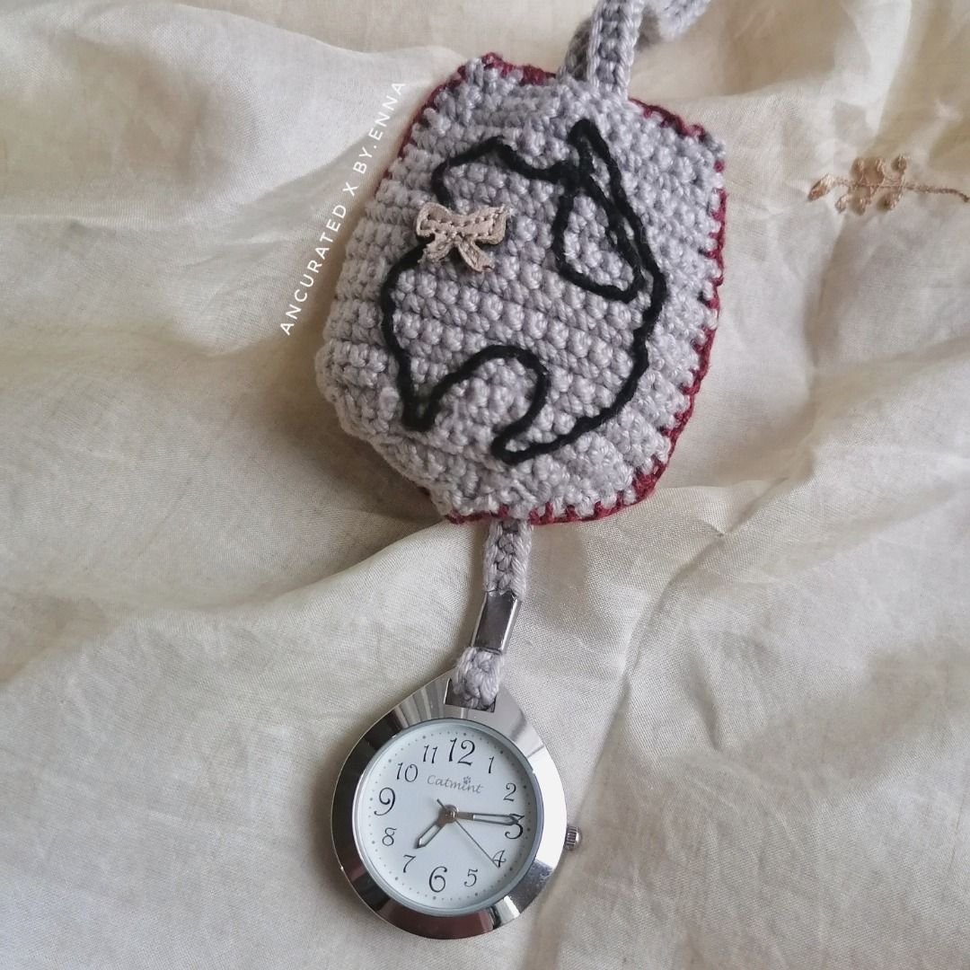 Crochet Catmint pocket watch (Category: Men's Watches) located in Escalante. Submitted by byenna (Listing ID 1467303623, Image 1). Description: This is an original watch from Catmint. since the original faux leather was completely peeling off, so I stripped it down and remade the casing entirely. Hand-crocheted the pouch, embroidered the little details, and added a fresh battery so it’s ticking perfectly again. It's a one-of-a-kind artisan piece 