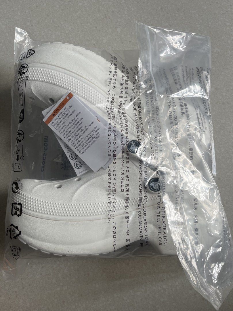 Crocs Bella Clog in White (Category: Flats & Sandals) located in Pasig City. Submitted by missclaud.essentials (Listing ID 1466890964, Image 2). Description: Size 8 Original prize P4495 Upto 50% off Rfs: income 24cm .