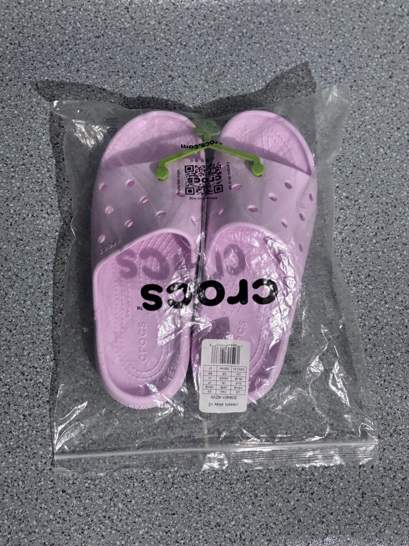 Crocs Classic Slide V2 Pink Sandals (Category: Slippers and slides) located in Quezon City. Submitted by capableturtle_25 (Listing ID 1467480279, Image 1). Description: - Item: Crocs Classic Slide V2 - Color: Pink - Condition: Brand new with tags, still in original plastic packaging - Features: Easy slip-on design, breathable upper ventilation holes, and textured footbed for extra grip - Perfect for casual wear, errands, or lounging.