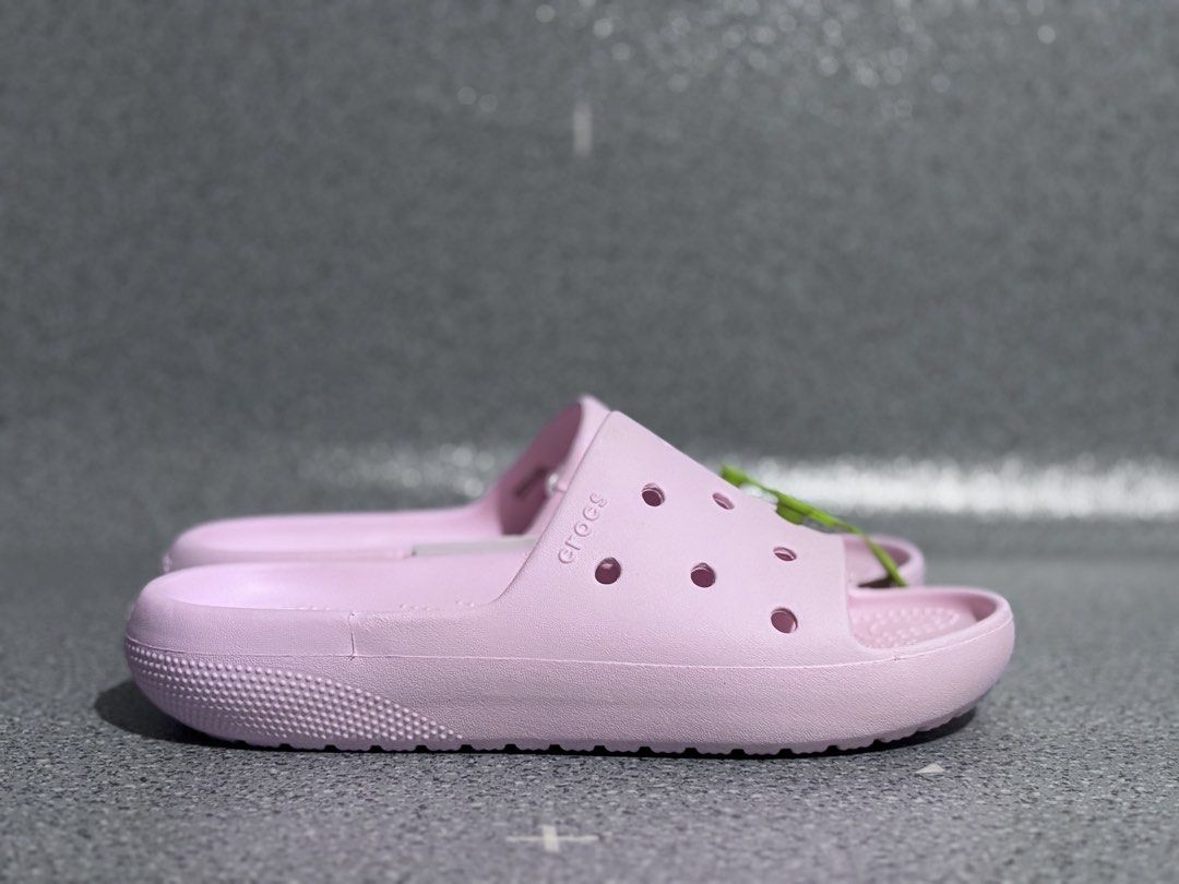 Crocs Classic Slide V2 Pink Sandals (Category: Slippers and slides) located in Quezon City. Submitted by capableturtle_25 (Listing ID 1467480279, Image 2). Description: - Item: Crocs Classic Slide V2 - Color: Pink - Condition: Brand new with tags, still in original plastic packaging - Features: Easy slip-on design, breathable upper ventilation holes, and textured footbed for extra grip - Perfect for casual wear, errands, or lounging.
