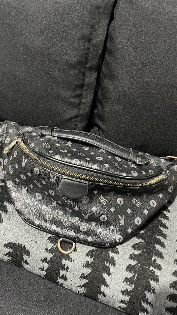 #crossbodybags #beltbag #monogram (Category: Cross-body Bags) located in Baliuag. Submitted by sirc_28 (Listing ID 1467416680, Image 1). Description: appears to be a black monogram belt or waist bag featuring a repeating pattern that resembles the Playboy Bunny logo combined with geometric motifs.
