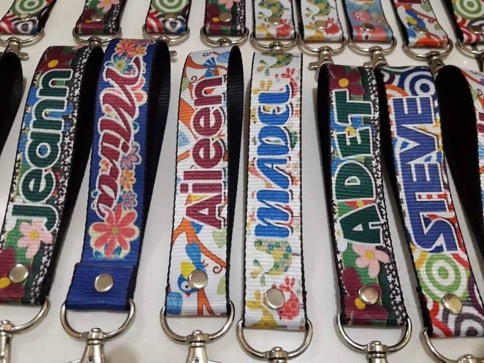 Custom Personalized Name Lanyard Wrist Strap Key Chain (Category: Handmade Craft) located in Manila. Submitted by charlottej01596 (Listing ID 1467408113, Image 2). Description: - Custom fabric wrist straps with floral patterns and personalized names - Sturdy metal swivel clasp for secure attachment - Convenient silver snap button closure - Multi-purpose: great for keys, ID cards, or water bottles - Multiple colors available - Kindly send your pre