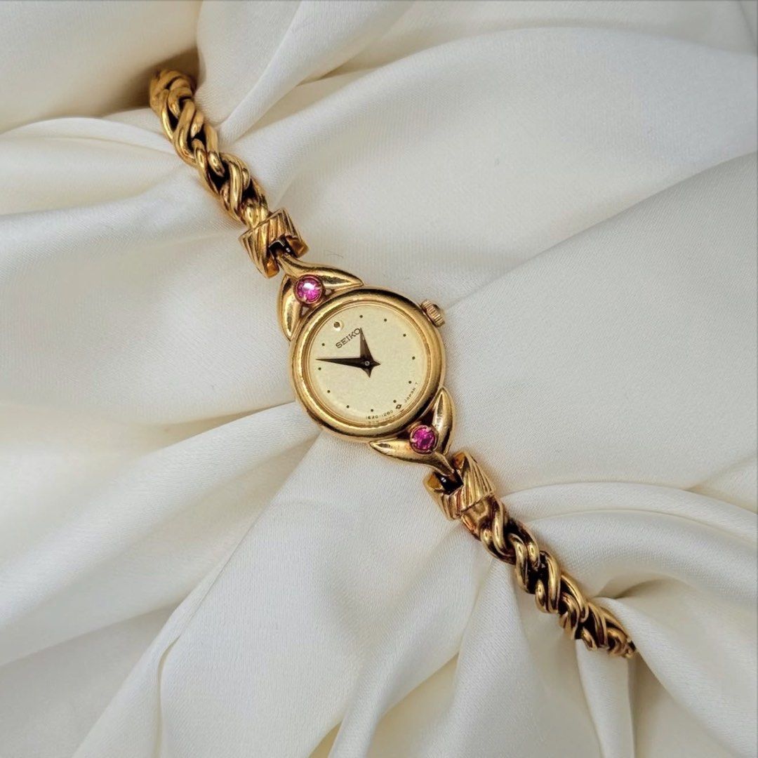 Dainty Seiko with Ruby Accents (Category: Women's Watches) located in Lipa City. Submitted by watchoutph (Listing ID 1467550344, Image 1). Description: Dainty Seiko Tissé with Pink Rubies Rope Bracelet/Twisted Chain Gold textured dial 15mm Up to 17cm wrist size Hardlex crystal Rare Quartz Excellent condition ₱12,800.